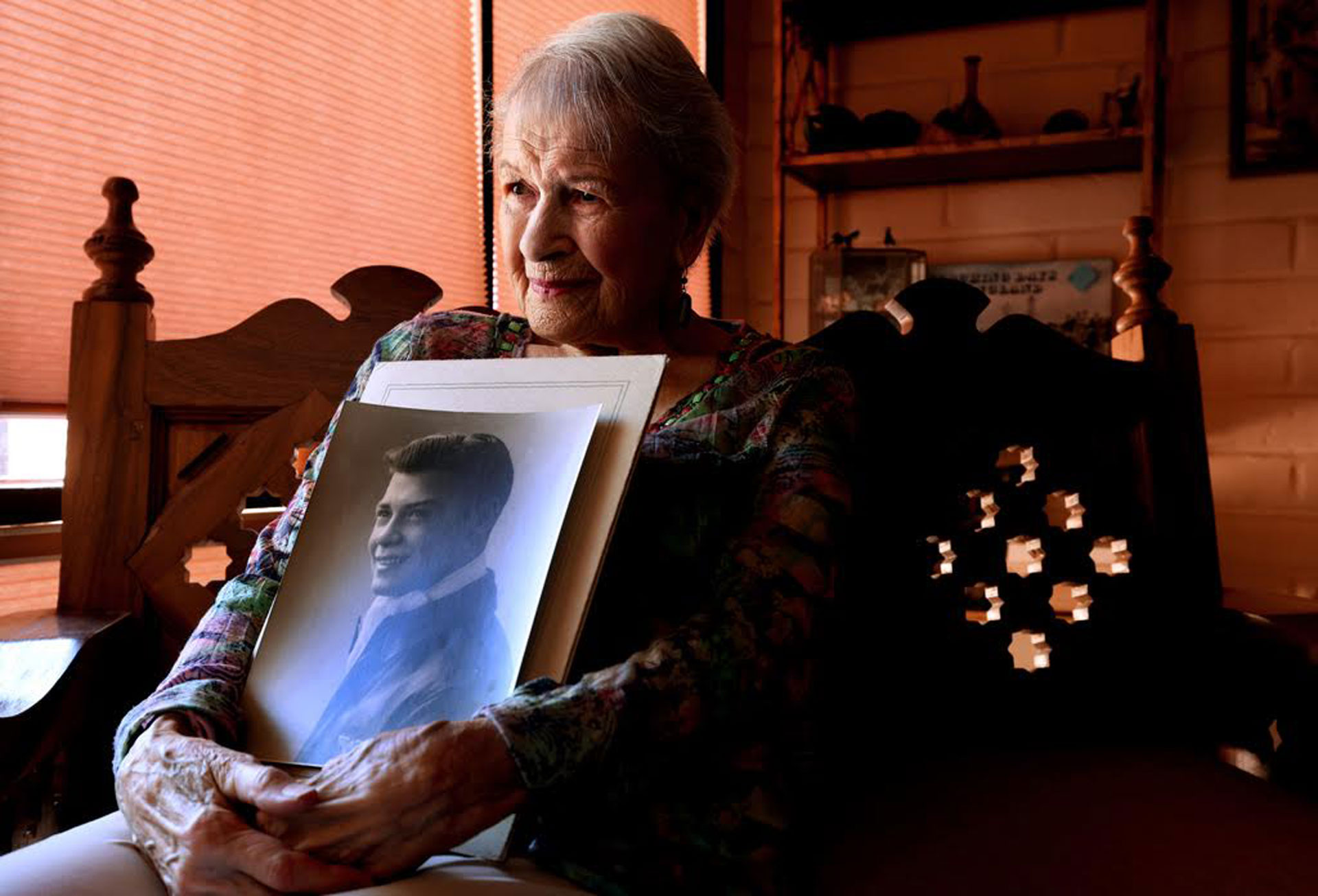 Christine Grady Gorder holding the photo of her WWII sweetheart U.S Army Staff Sergeant Ward Sackal who was killed in combat in Europe. The 98 year old has visited has visited his grave in France 11 times. 