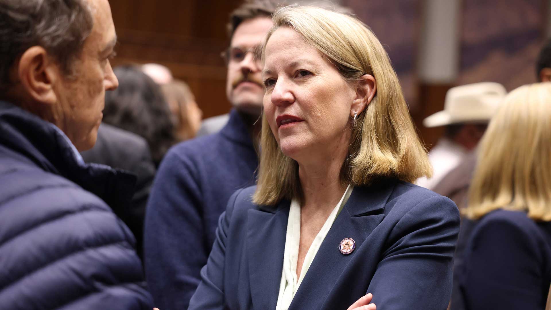 Attorney General Kris Mayes speaking with attendees on the floor of the Arizona House of Representatives on opening day of the 57th legislature in Phoenix, Arizona. January 13, 2025