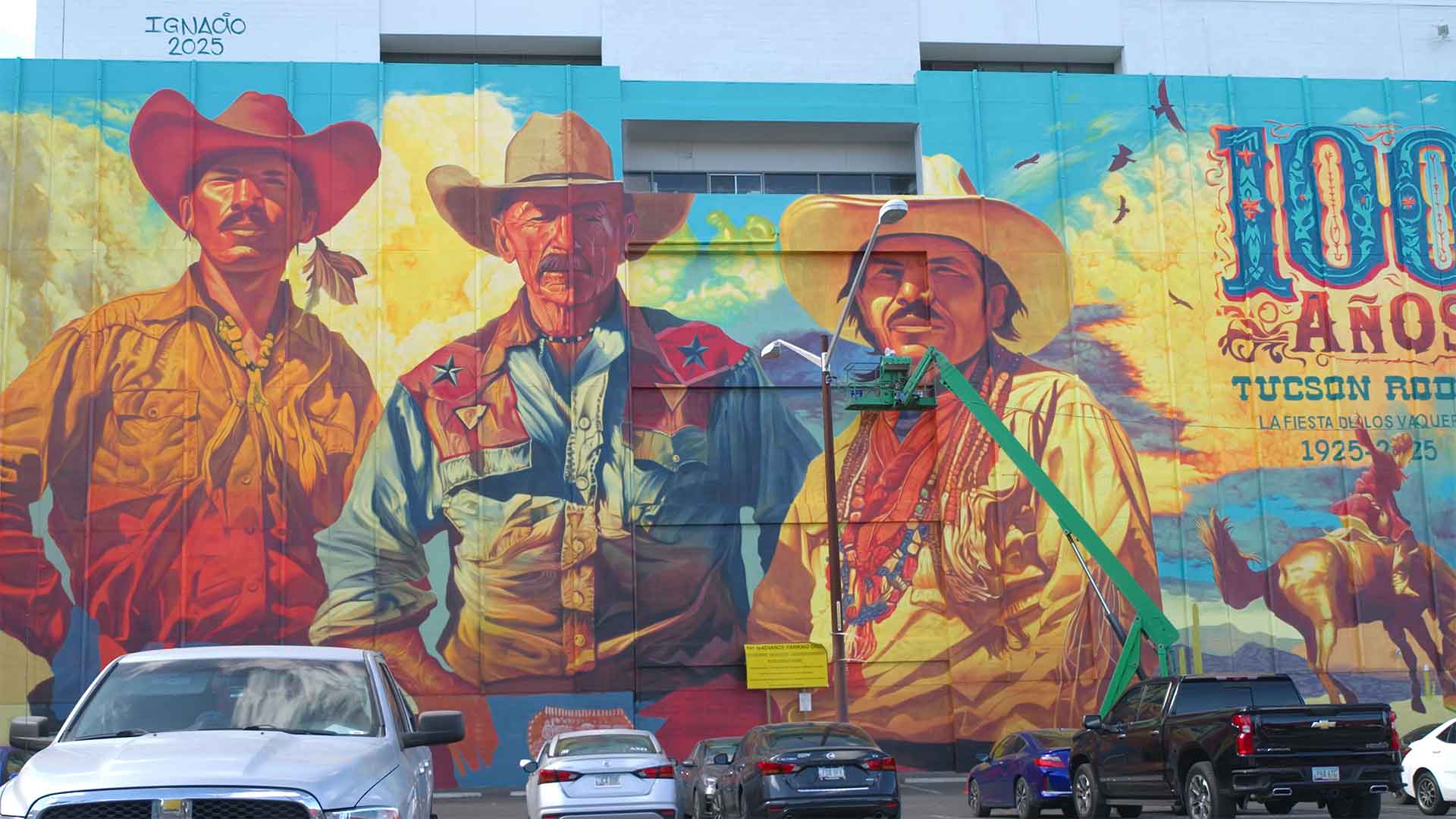 Muralist Ignacio Garcia's La Fiesta de Los Vaqueros Tucson Rodeo Mural. The massive and vivid mural commemorates the rodeos 100th anniversary and honor Tucson’s multicultural heritage. 