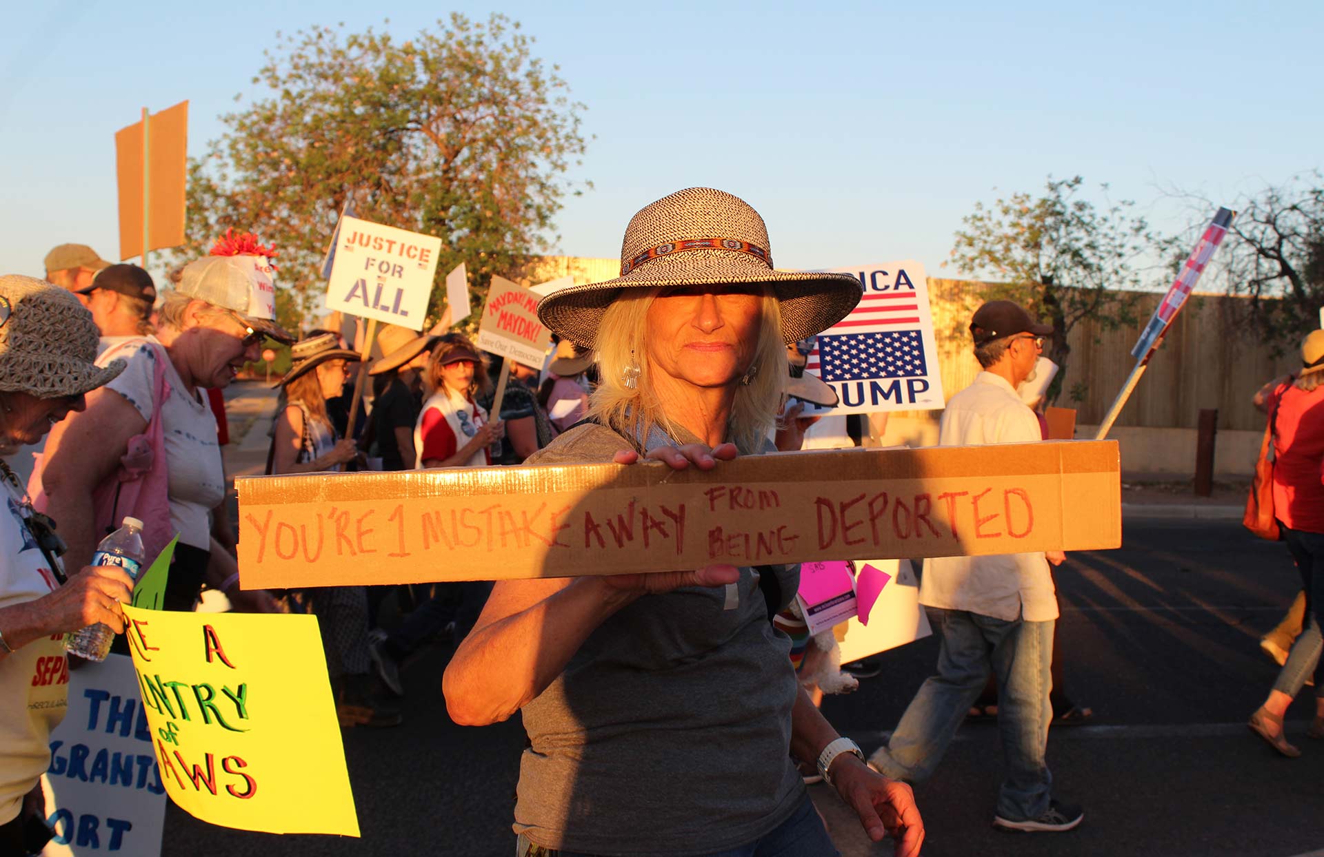 Protestor holding sign 5-1