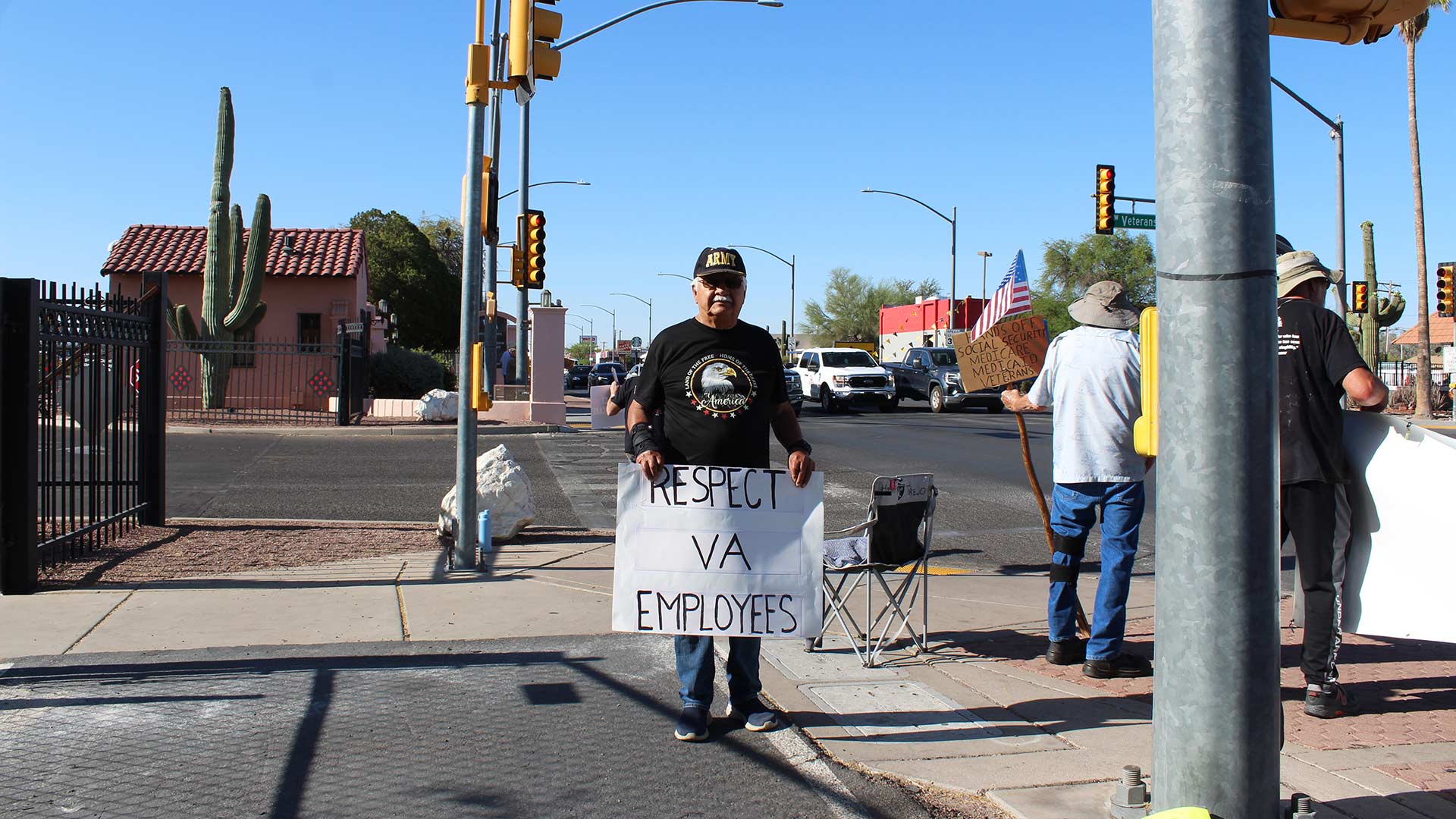 Henry Trejo outside of the Tucson VA on Friday, May 2, 2025. Trejo, a veteran, says he is supporting VA staff amid potential layoffs agency-wide. 