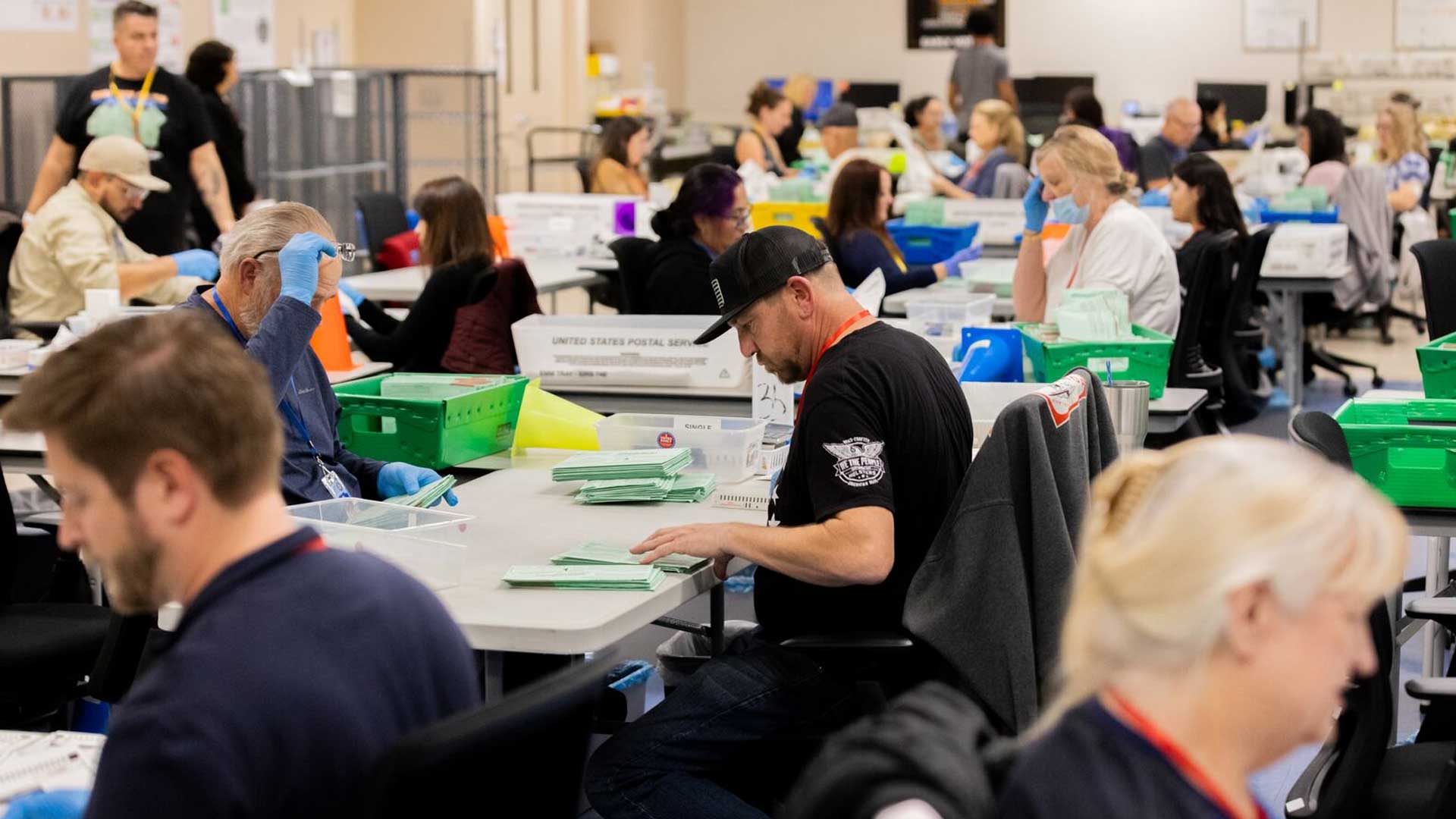 Election workers open ballots at Maricopa County's election center in Phoenix during the Nov. 5, 2024 presidential election. Maricopa County is set to hire a company to spend a year auditing its election procedures.
