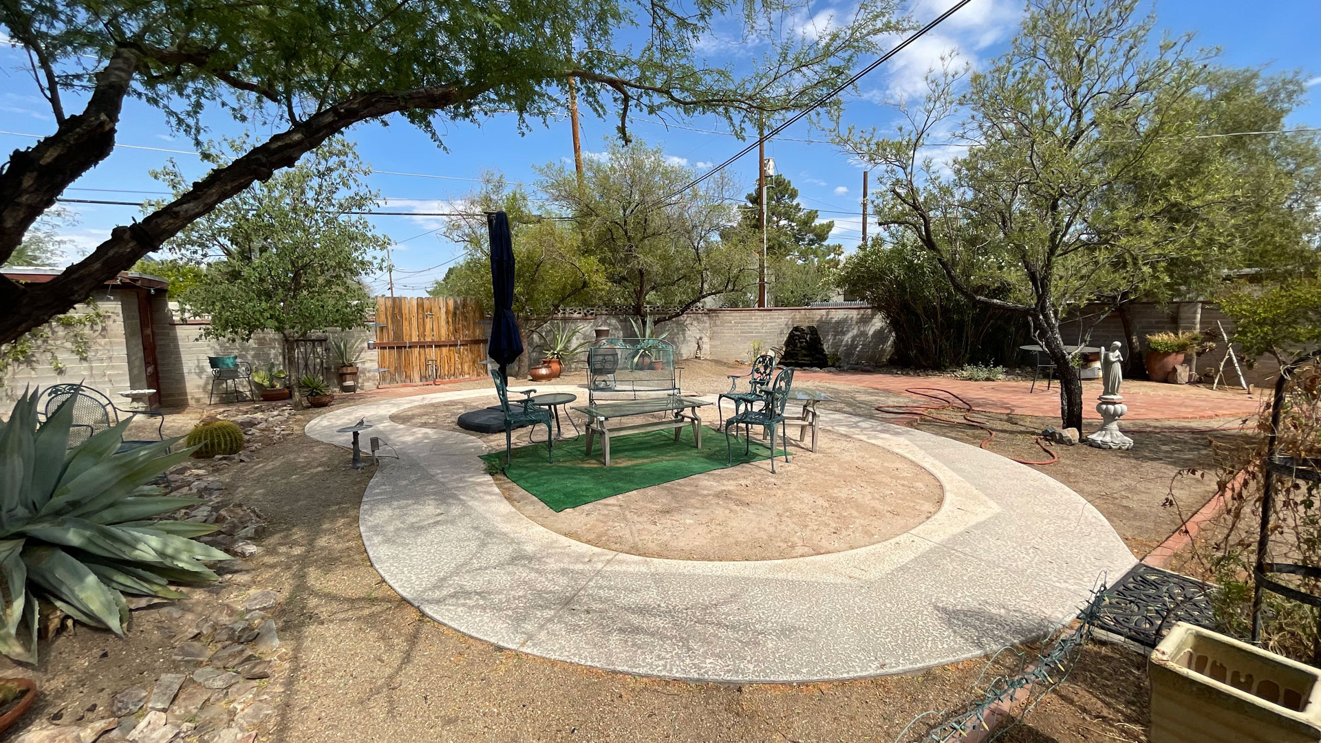 Tucson Gilbert Guillen stands by his former swimming pool which he had covered with soil and is using for patio furniture. He’s also considering planting a tree or other vegetation at the former swimming pool site.