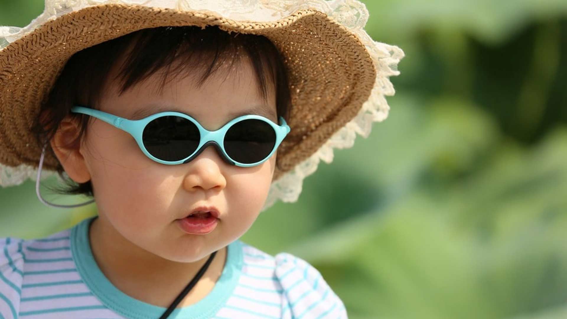 Child wearing sunglasses.