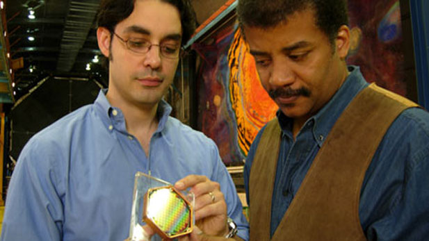 NOVA scienceNOW host Neil deGrasse Tyson (left) and MIT physicist Enectalí Figueroa-Feliciano use a model of a dark matter detector