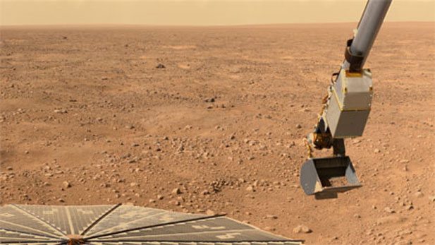 Phoenix Mars Lander scoops soil
