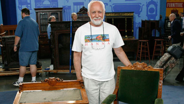 owner proudly displays an heirloom desk and chair