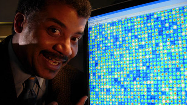 Host Neil deGrasse Tyson confronts his own DNA. The computer monitor displays a microscopic image of a gene chip revealing Tyson's genetic profile. 