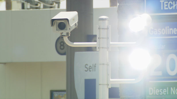 Camera to catch red light runners in Tucson flashes to illuminate the intersection .